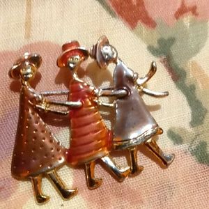 Vintage enamel women dancing brooch.